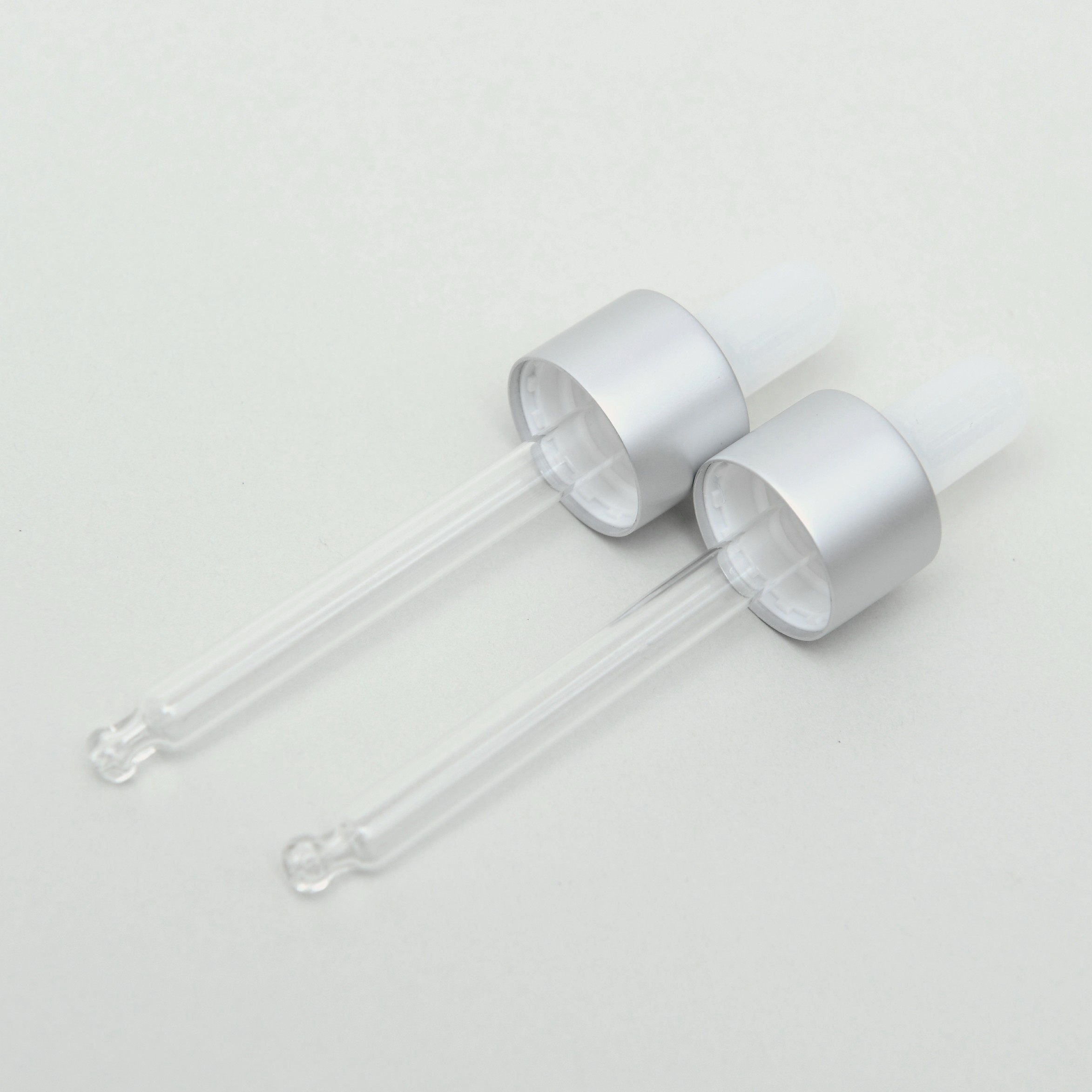 Glass pipette with ivory white teat and silver closure